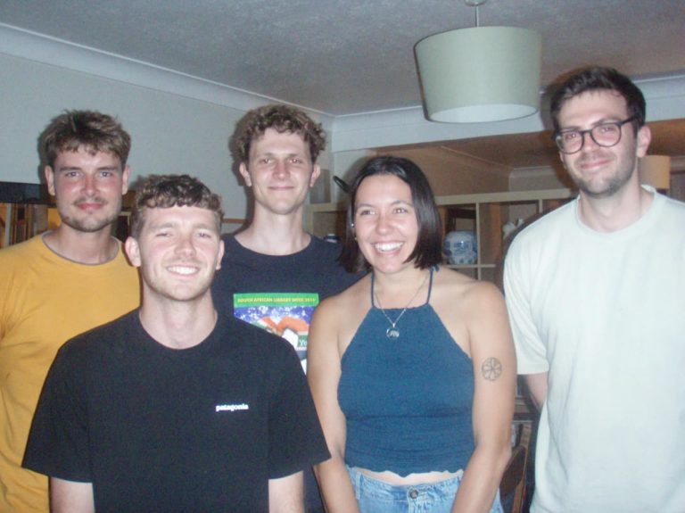 Champion Trees Shares Autumn Songs from a Band Far from Home Champion Trees band members. Left to right: Lex Pienaar (bass), Michael Burke (saxophone), Francis Christie (vocals, guitar), Michelle Hromin (clarinet), James Bickford-Smith (violin and synthesizer). Not pictured: Langa Dubazana, who remains in Cape Town.